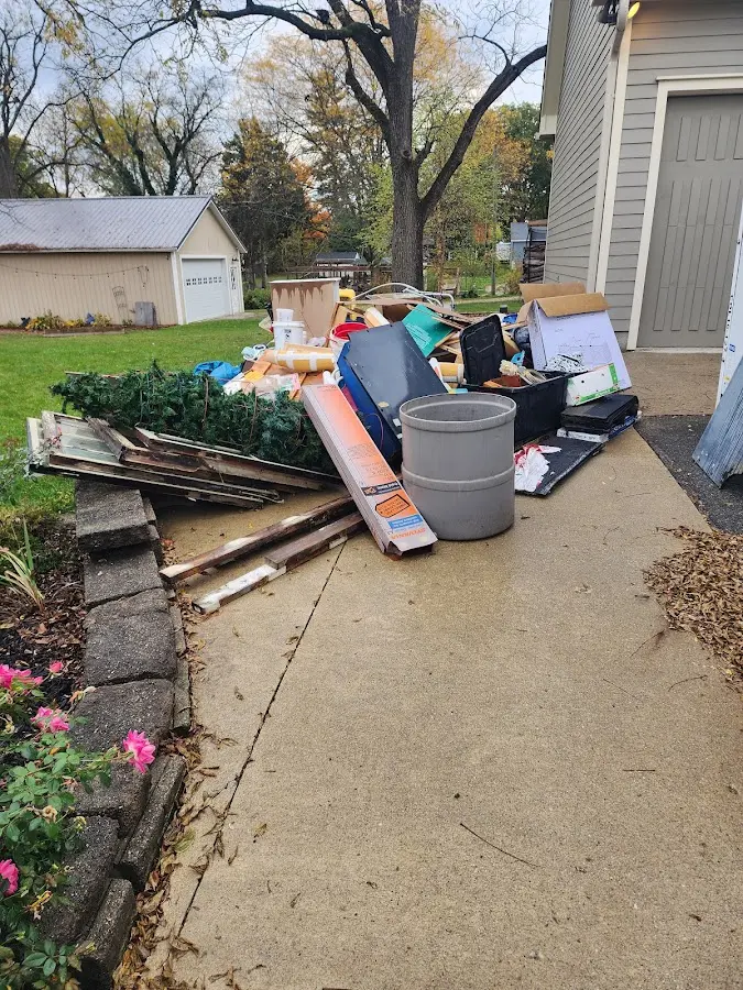 Dumpster being loaded with debris for 3 Yard Dumpster Rental in Lower Moreland